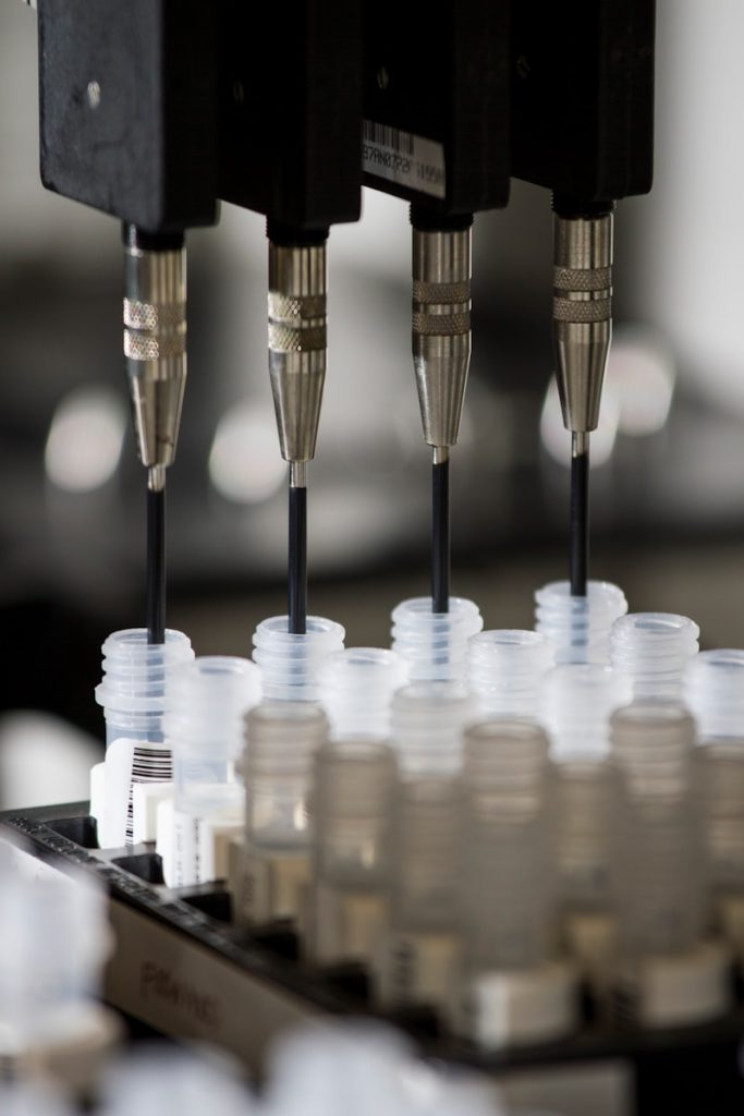 a group of plastic cups sitting on top of a machine